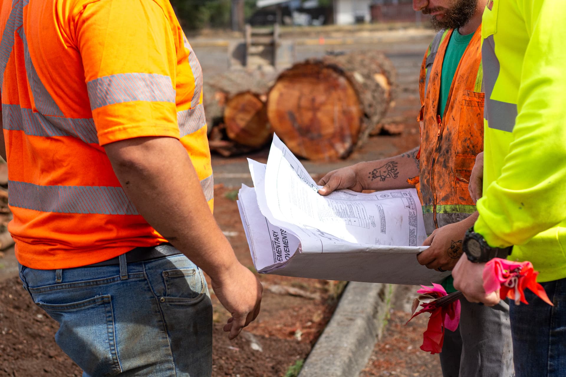 JIT crew reviewing utility plans during a project