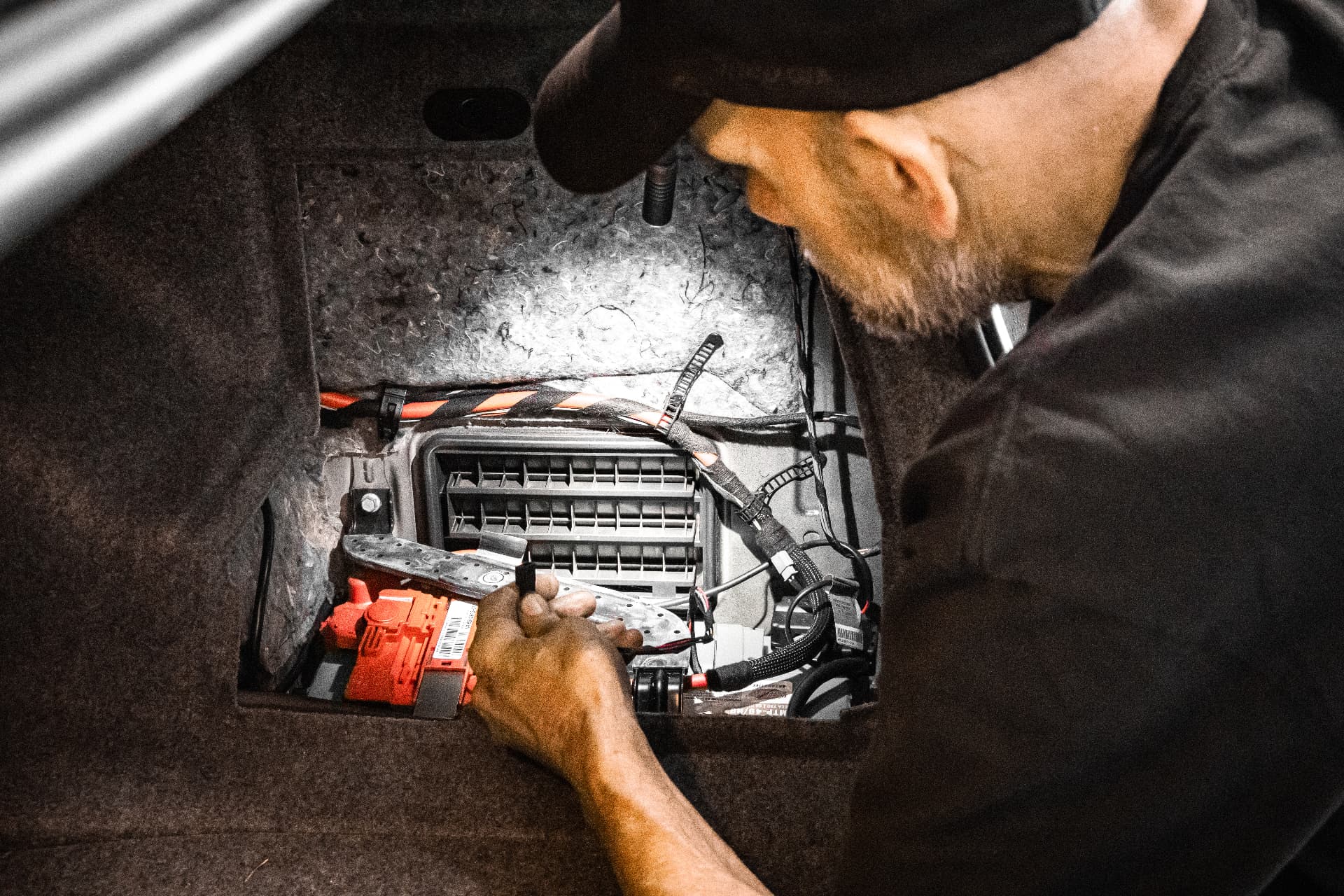 Olympia Autohaus technician completing an electrical repair